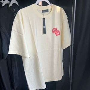 Ami Off-White Tee with Bold Red Emblem